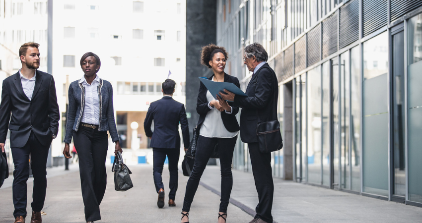 Business People Walking Outside The Business Building