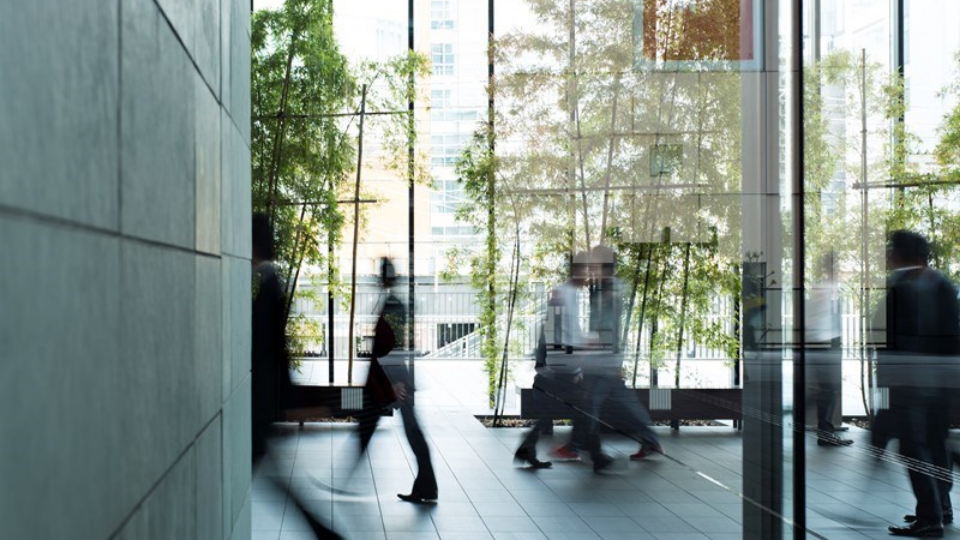 Business person walking in a urban building