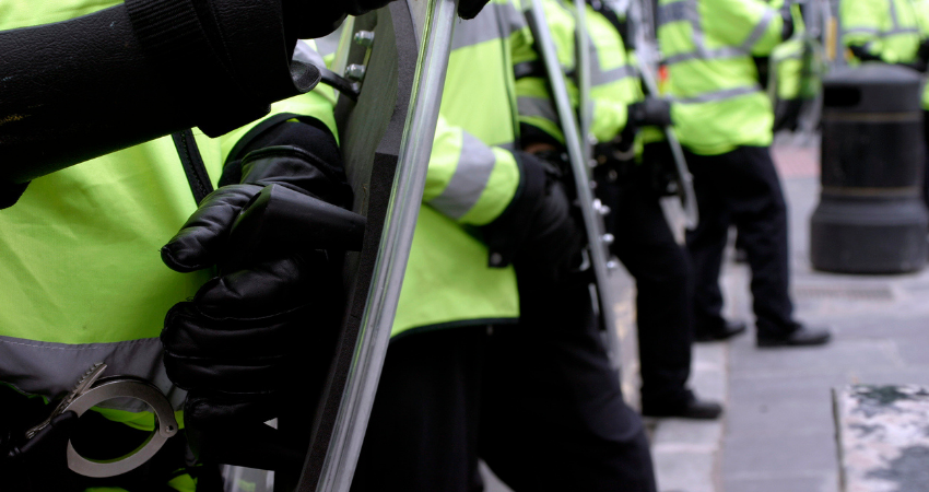 Men in yellow vests blocking the way