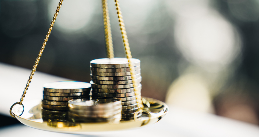 Coins stack with balance scale