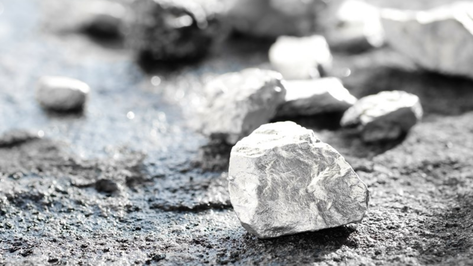Lump of silver or platinum on a stone floor