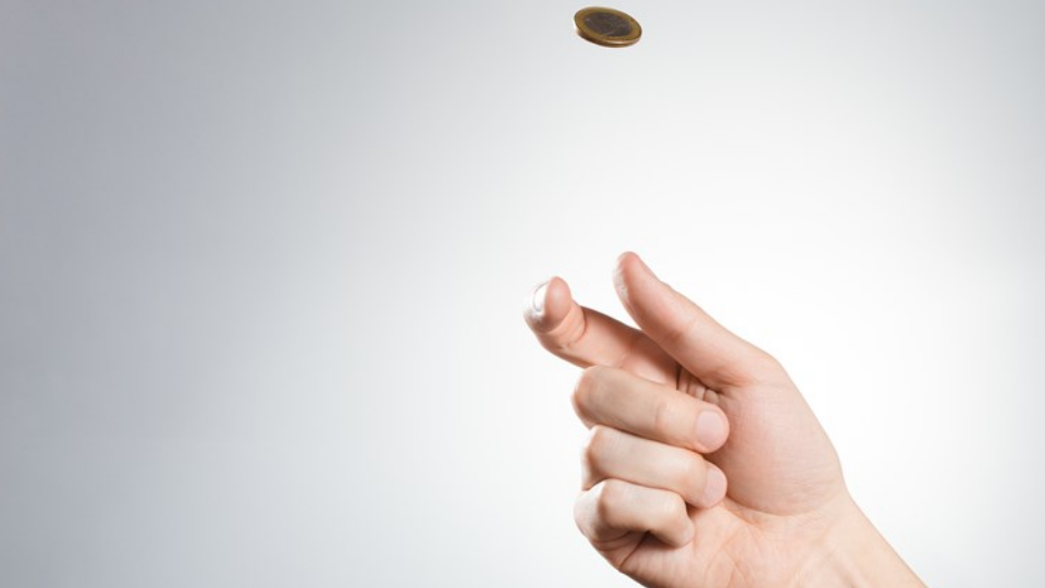 Hand flipping coin