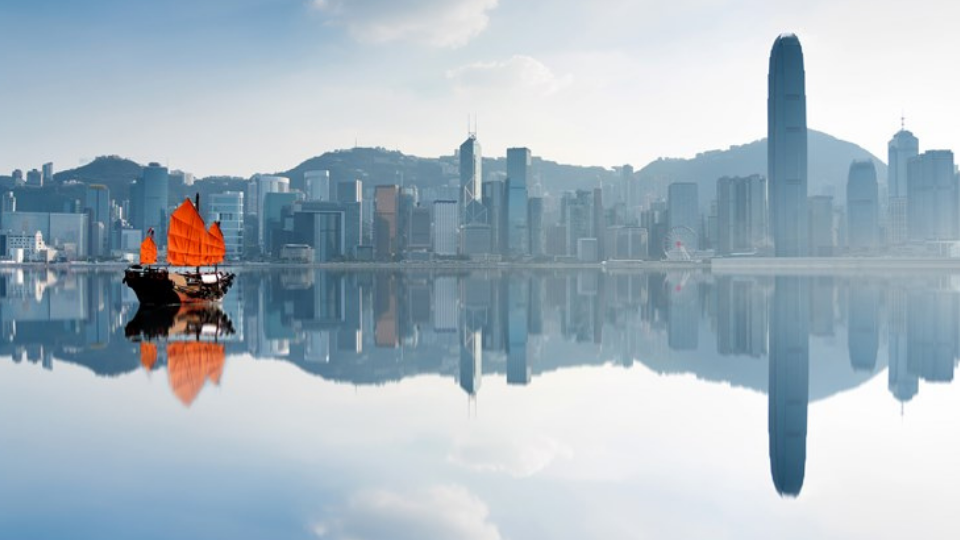 Junk boat crossing Hong Kong harbour