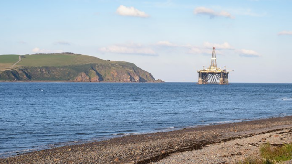 Oil rig offshore close to coast line