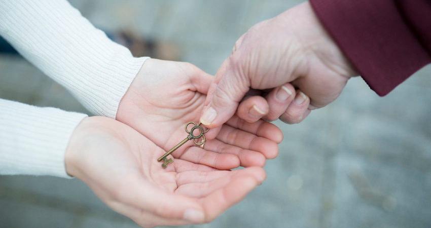 Mother and daughter give the key