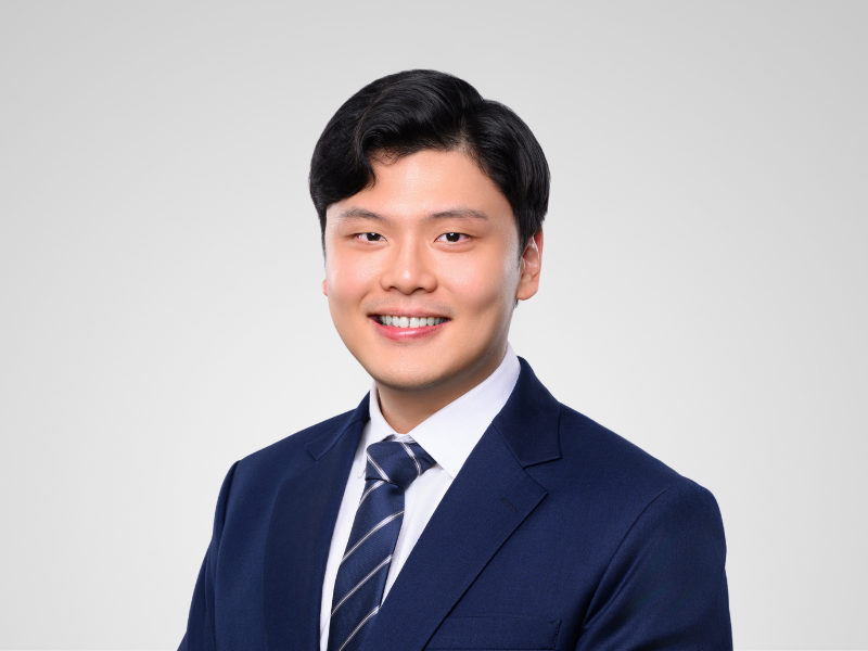 Titus Teo Harneys front portrait image on a grey background