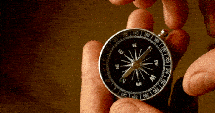 Compass held in two hands