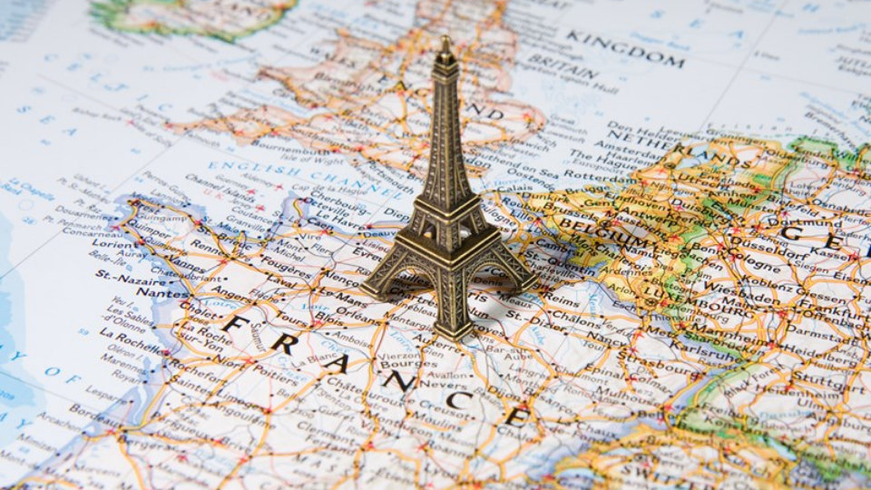 Statue of Eiffel Tower on a map