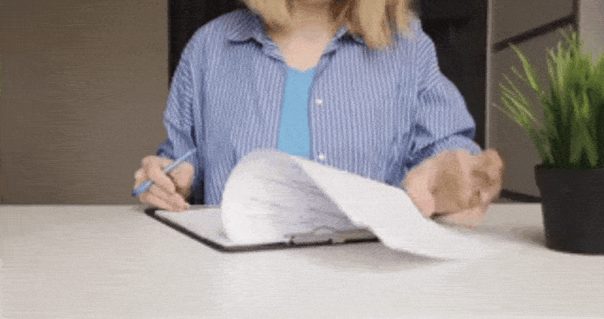 Documentation, a woman writes on forms, legal paperwork,questionnaire filling