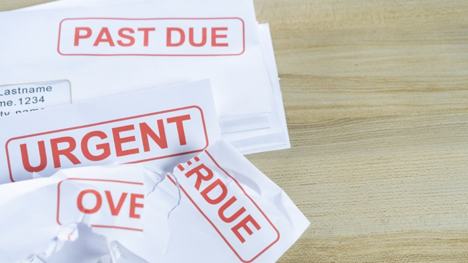 Outstanding invoices are placed on the table