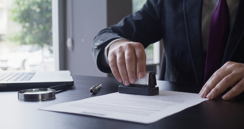 Businessman Signing Contract In The Office