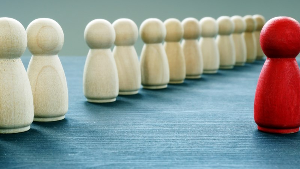 Be unique and different. Red figurine is stand out from the crowd
