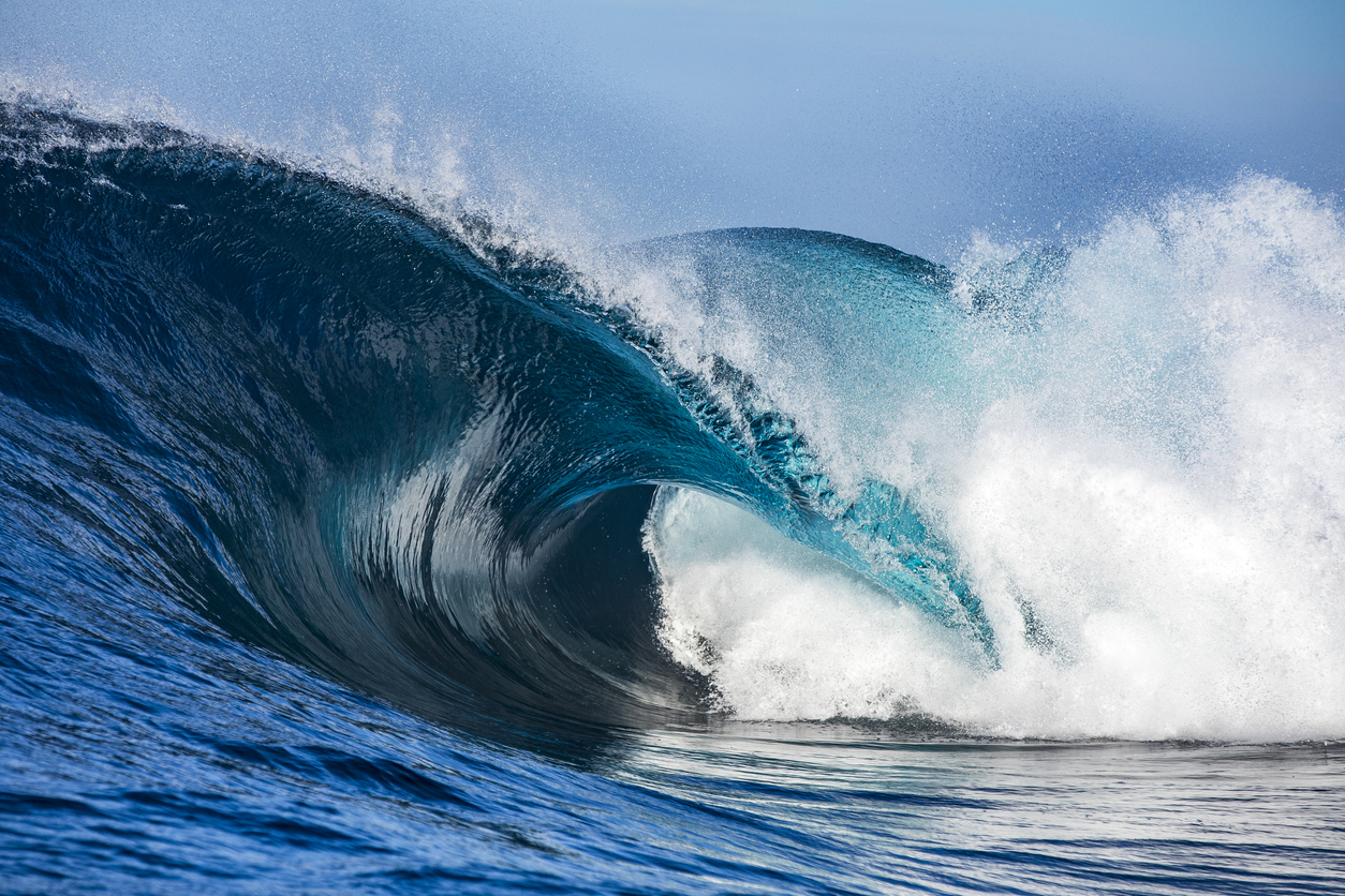 Powerful blue breaking wave