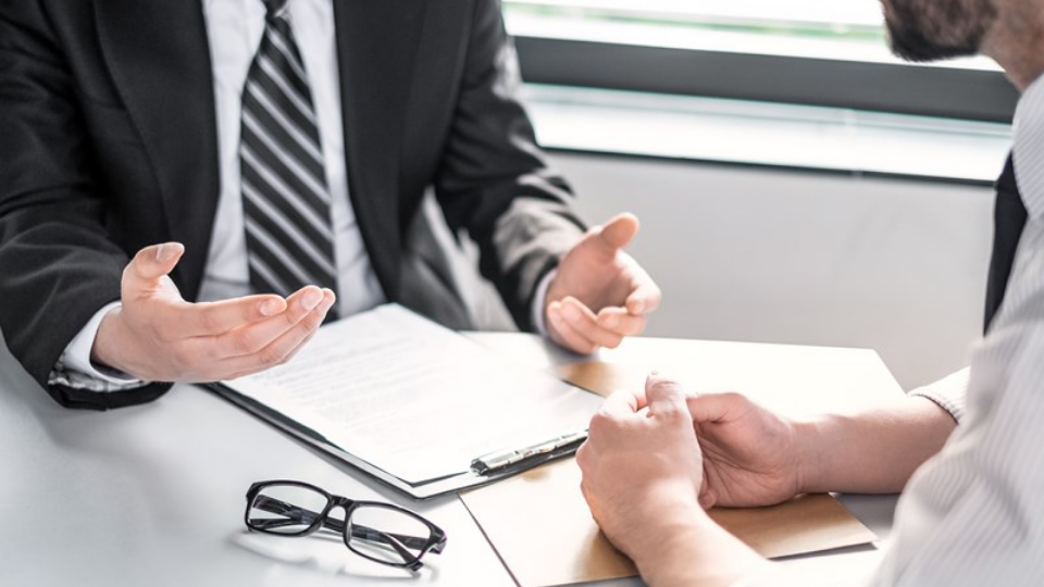 Business people negotiating a contract