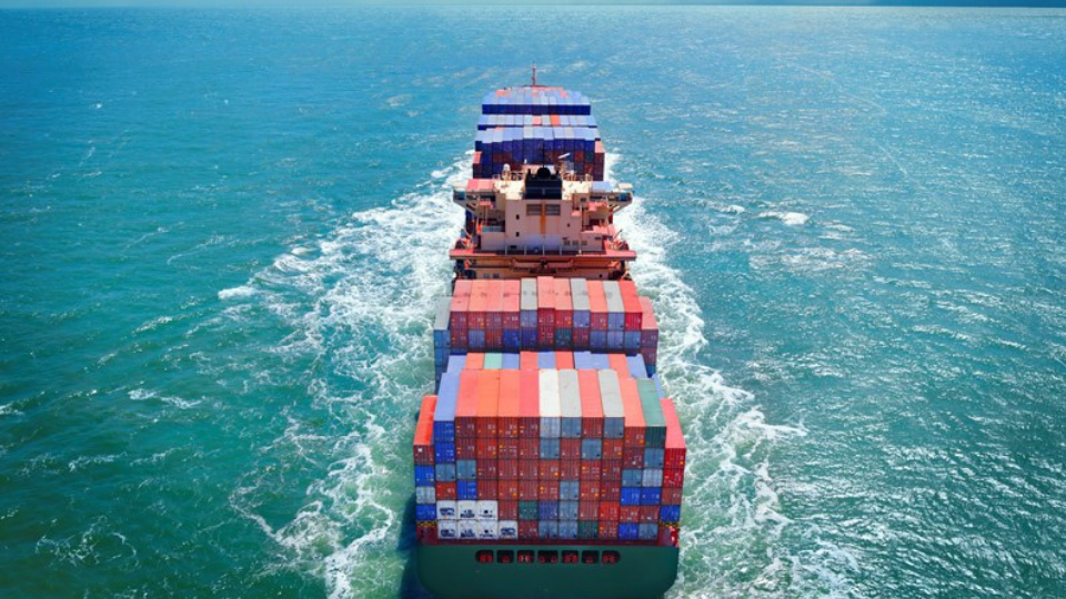 Aerial view of freight ship with cargo containers